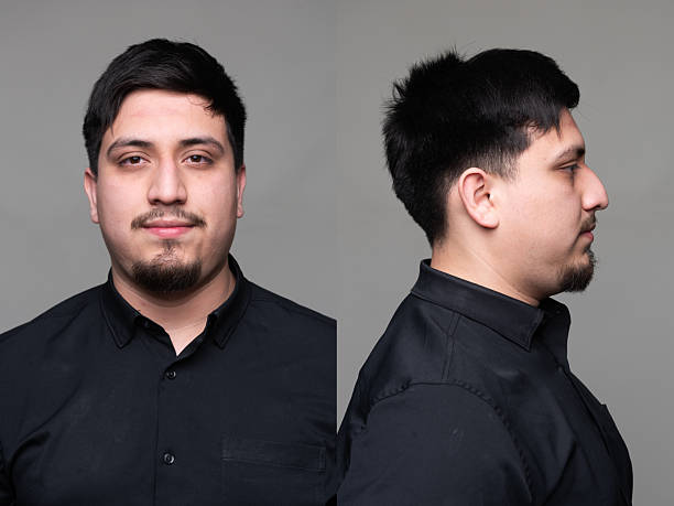 istock Hispanic man front and profile mugshots 2210119460