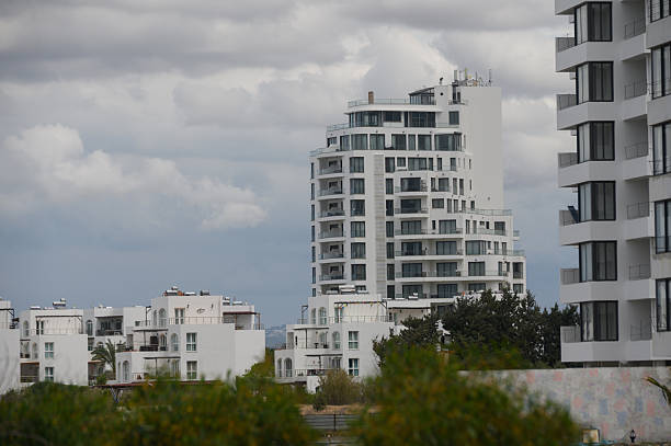 istock Modern architecture blooms against a cloudy sky in a vibrant coastal city 2210120603