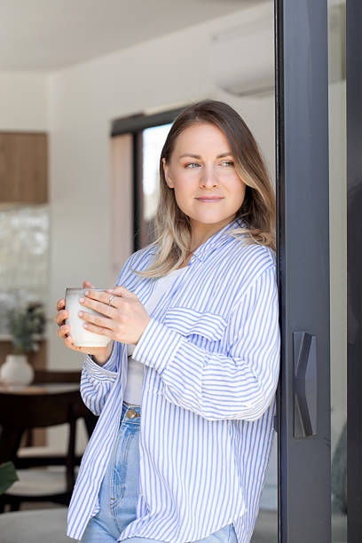 istock Relaxed morning at home with coffee in hand 2210125103