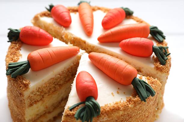 Delicious carrot cake on white background, closeup