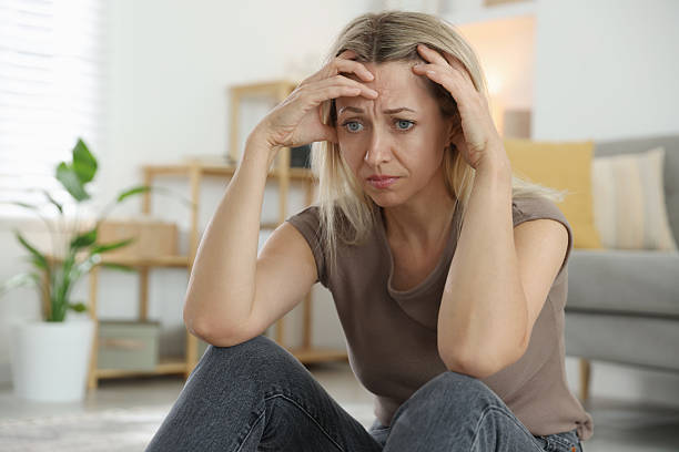 istock Menopause. Woman suffering from headache at home 2210129557