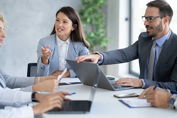 istock Engaged Discussion in Business Meeting with Vibrant Ideas 2210130671