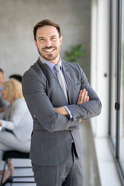 istock Charming Businessman in Stylish Office Attire Smiling 2210130739