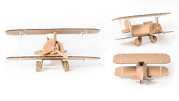 istock DIY cardboard biplane multiple views, handmade airplane set 2210130844