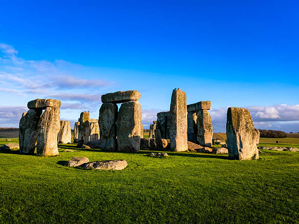 istock A large group of stone structures are surrounded by a lush green field 2210135195