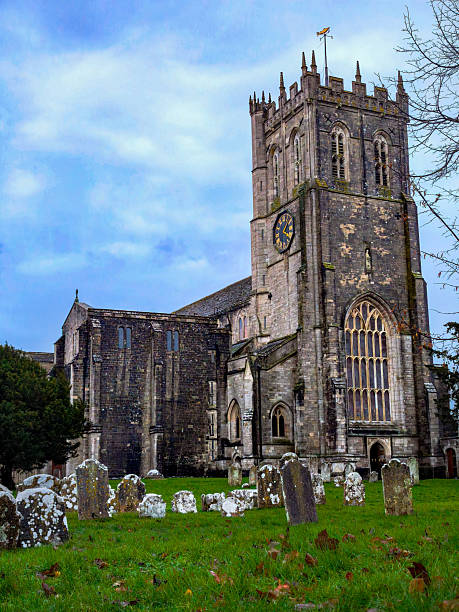 istock A large church with a clock tower and a cemetery in the background 2210136154