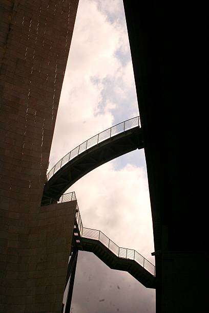 istock Modern urban design: architectural metal staircase against dramatic sky. 2210145615