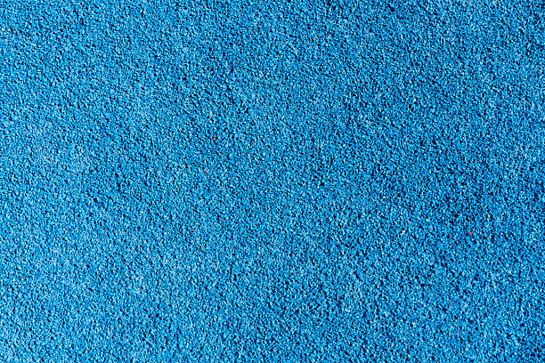 istock An eye-catching bright blue surface featuring a textured finish, suitable for recreational areas, play zones, or sports facilities, often used in parks or gyms 2210147456