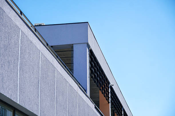 istock A striking building exterior features smooth surfaces and a sleek design against a clear blue sky, emphasizing modern architectural aesthetic 2210147485