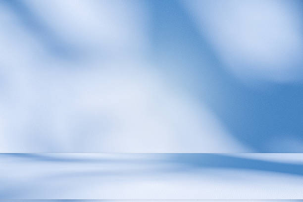 istock Studio style background wall decoration presentation uses white and blue tones. with shadows cast from a nearby window, concept creating a decorative 2210151560