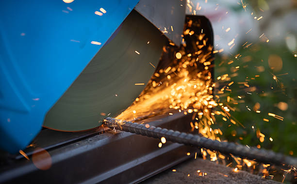 istock Worker cutting deformed steel bar in construction site. 2210152204