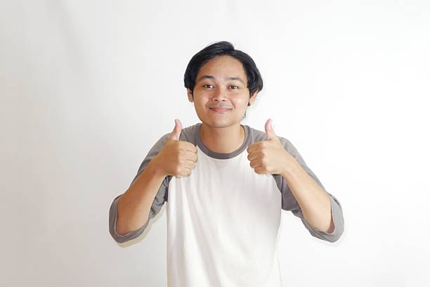 istock Handsome Indonesian man taking a selfie portrait 2210154040
