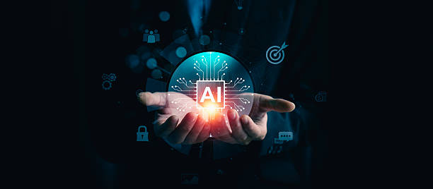 istock Futuristic concept of artificial intelligence technology showing a businessman holding a glowing AI chip, symbolizing control, responsibility, and the powerful potential of intelligent data processing 2210154232