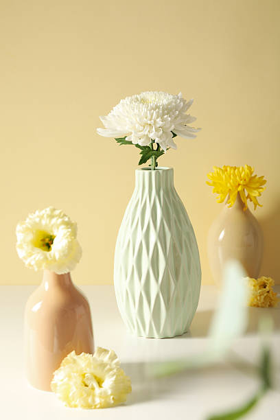 istock Fresh flowers in a vase on a light background. 2210155209