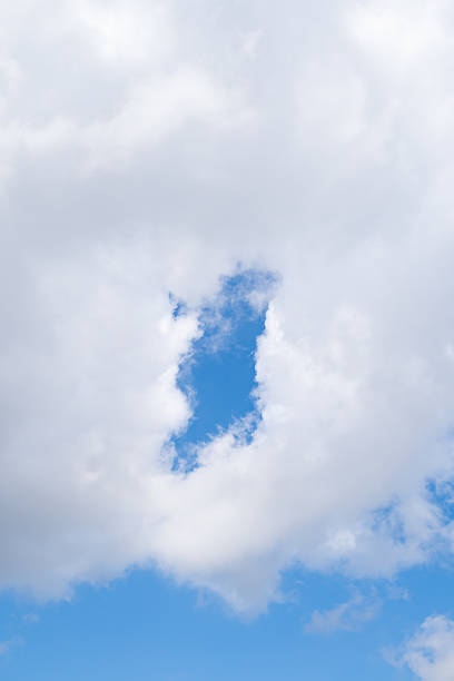 A Portrait-Style Photo of a Cloud with a Distinct Opening