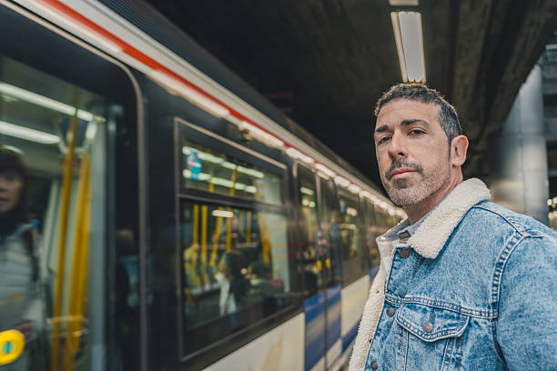 istock Confident businessman waiting for subway train in station 2210158062