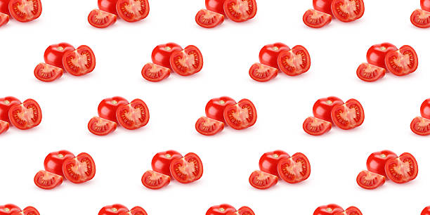 istock Seamless pattern of whole and cut tomatoes on white background 2210162397