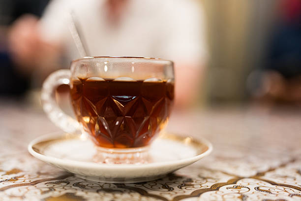 Steaming hot tea in glass mug