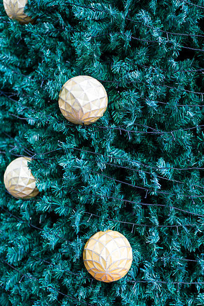 istock Gold colored Christmas decoration hanging on the Christmas tree 2210162714
