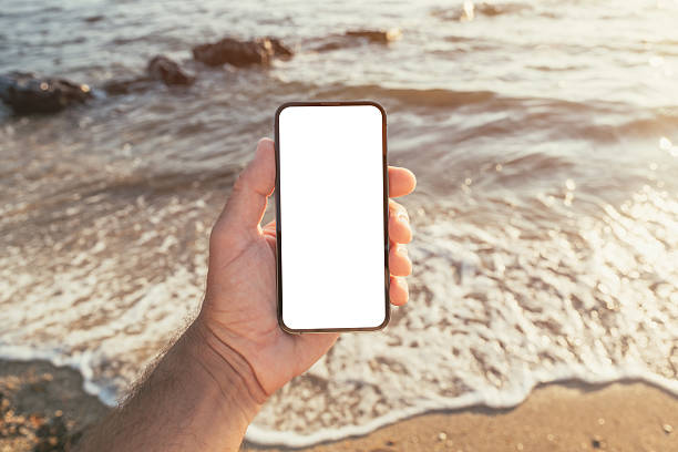istock Smartphone screen mockup at seaside in summer during holiday vacation 2210163699