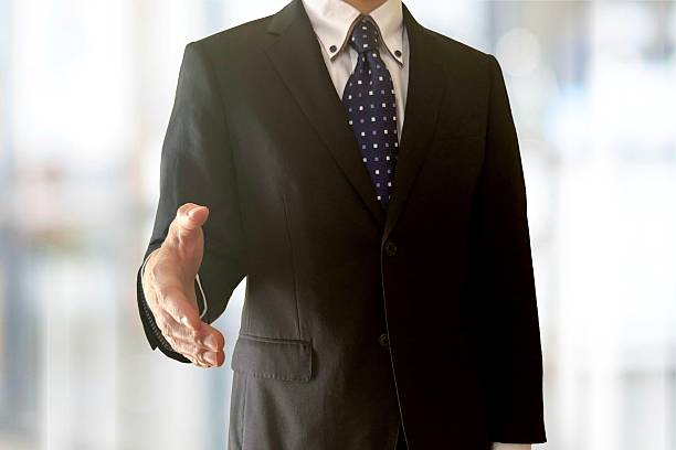 istock Businessman holding out his hand in a handshake pose 2210164830
