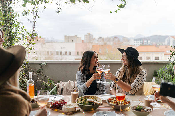 istock Balcony dinner party with friends 2210165100