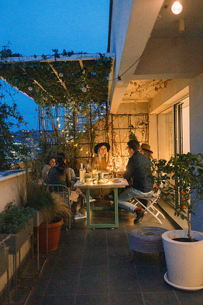 istock Balcony dinner party with friends 2210165143