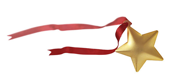 istock flying star with a red satin ribbon developing, isolated on a white background 2210166876