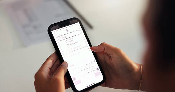 istock Hands, phone screen and website with flight booking for business trip, ticket information or online registration. Closeup display, smartphone or travel agency webpage for holiday or destination 2210167316