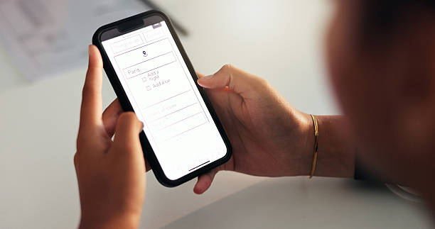 istock Hands, phone screen and online with flight booking for trip planning, itinerary adventure or holiday destination. Schedule display, smartphone and travel agency webpage for vacation or location 2210167340
