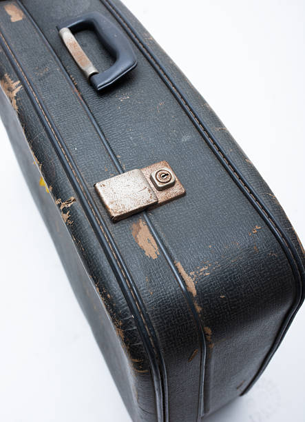 istock A black old fashioned business brief case. 2210168437