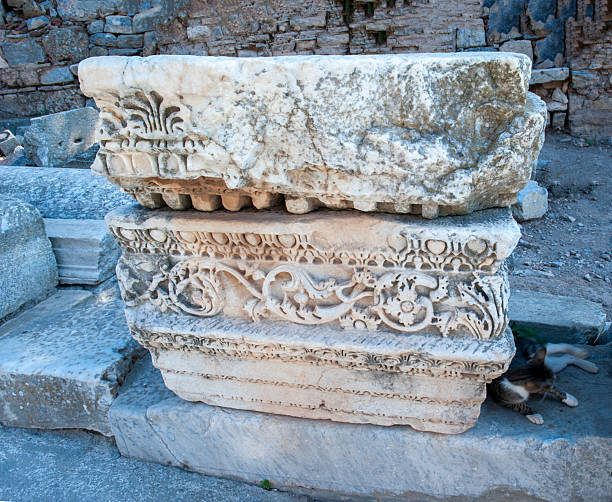 istock Ionic Greek Column or Pedestal and sleepy cat 2210170384