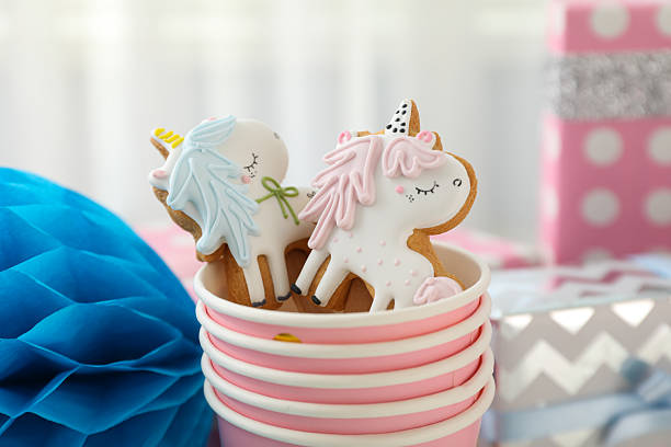 istock Gingerbread cookies in paper cups on light background, close up 2210170771