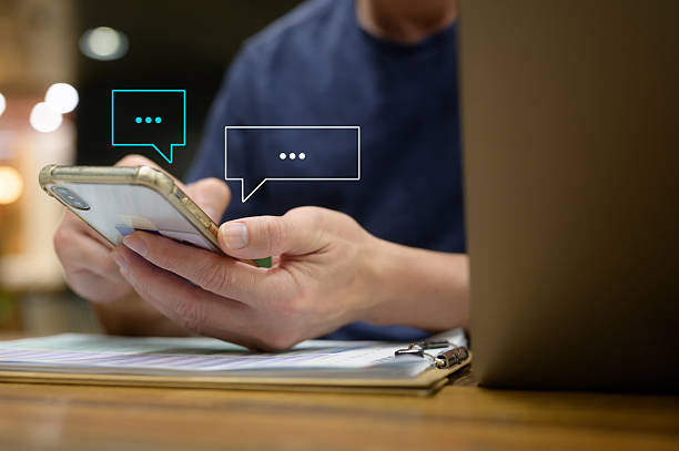 istock Social Media Man hand using smartphone typing live chat chatting on application communication digital web and social network concept. Social media application chat box 2210171197