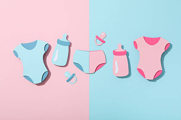 istock Paper baby things on blue and pink background, top view 2210171246