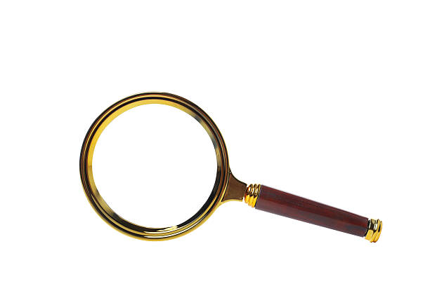 close up of magnifying glass against blue background