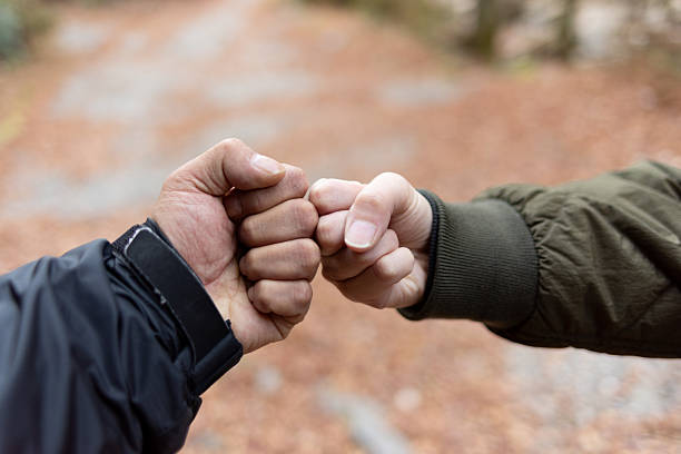 two people fists together
