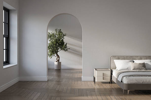 Empty white wall with arched entry and furniture decoration.