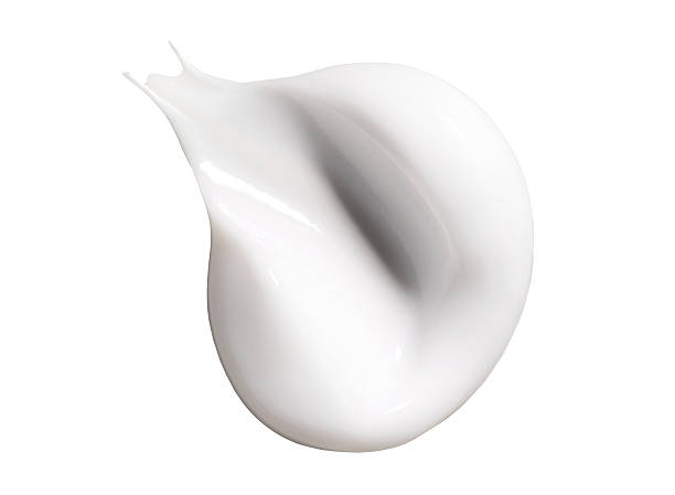 istock cosmetic sample smear of cream on white background 2210175358