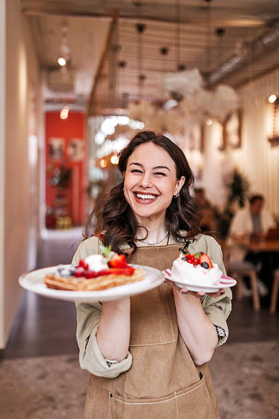 Friendly Staff Bringing Freshly Baked Joy