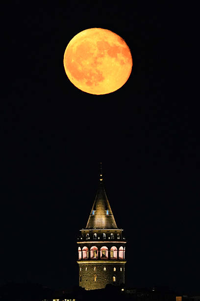 istock Galata Tower and Full Moon in Istanbul, Turkiye 2210183114