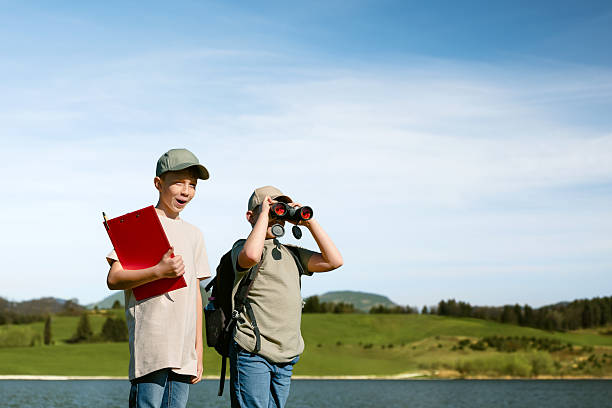 istock Boys exploring nature on the lakeshore. 2210183330