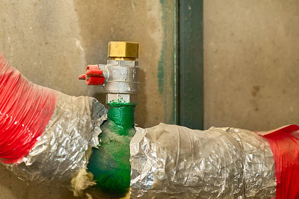 istock Water supply.Valve shutting,pipes wrapped with insulation in basement 2210183387