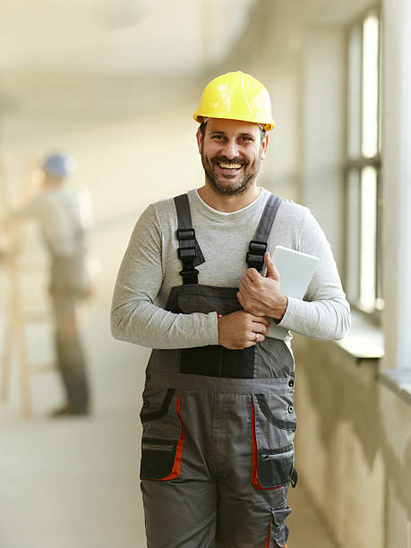 istock Happy manual worker on the move at construction site. 2210183467