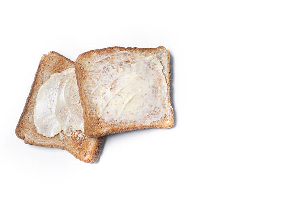 istock Sliced fresh bread and butter isolated on white background 2210190417