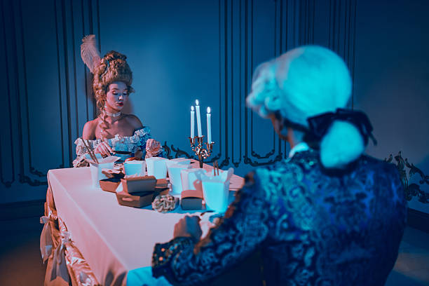 istock Baroque couple enjoying a unique dining experience in elegant attire during a theme party evening indoors 2210192715