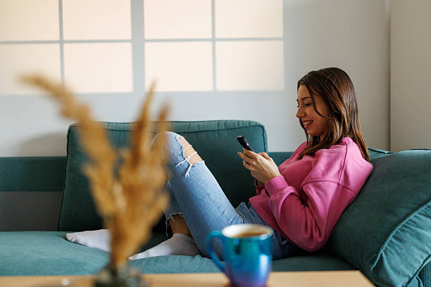 istock Beautiful young woman relaxing at home 2210192954