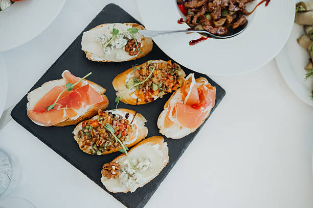 istock Gourmet appetizers displayed beautifully on a serving board at a dining event 2210197456