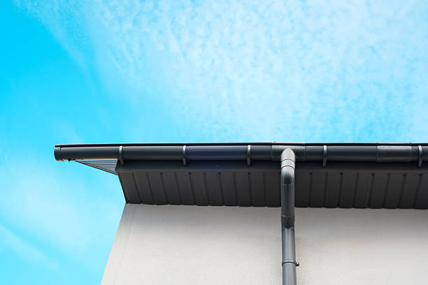 istock Roofline and gutter against a clear blue sky in bright daylight 2210197601