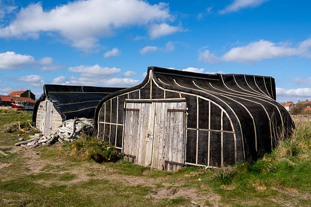 Upturned boats used as sheds on Holy Isle, Northumberland